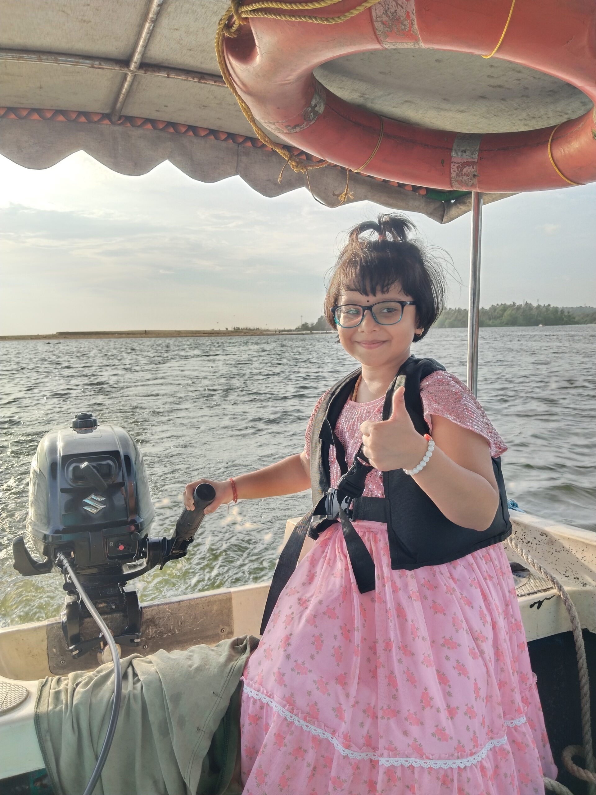 A  tourist child in Poovar, close to Thiruvananthapuram, Kerala, enjoying a boat ride on the Poovar Backwaters
